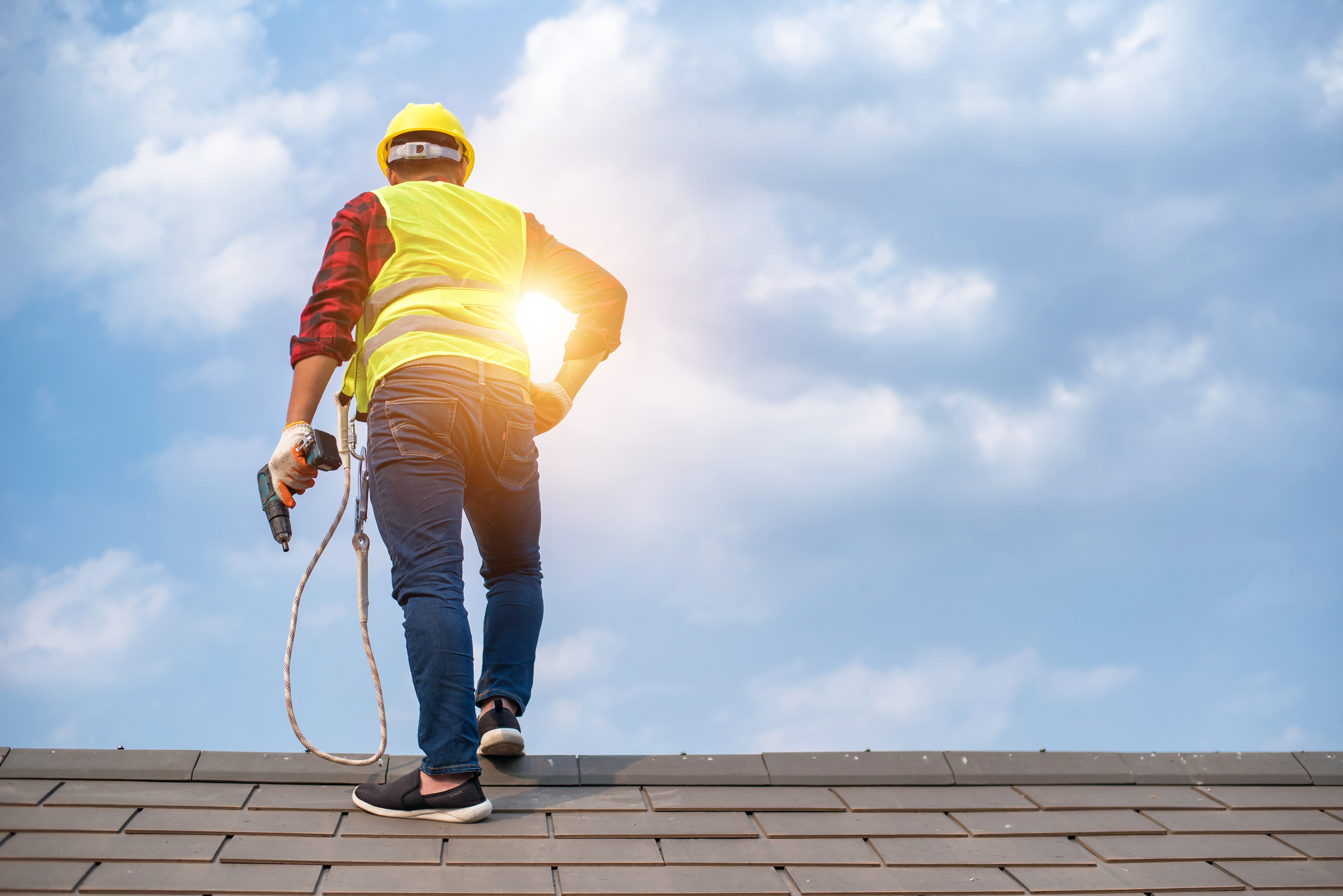 man standing on a roof